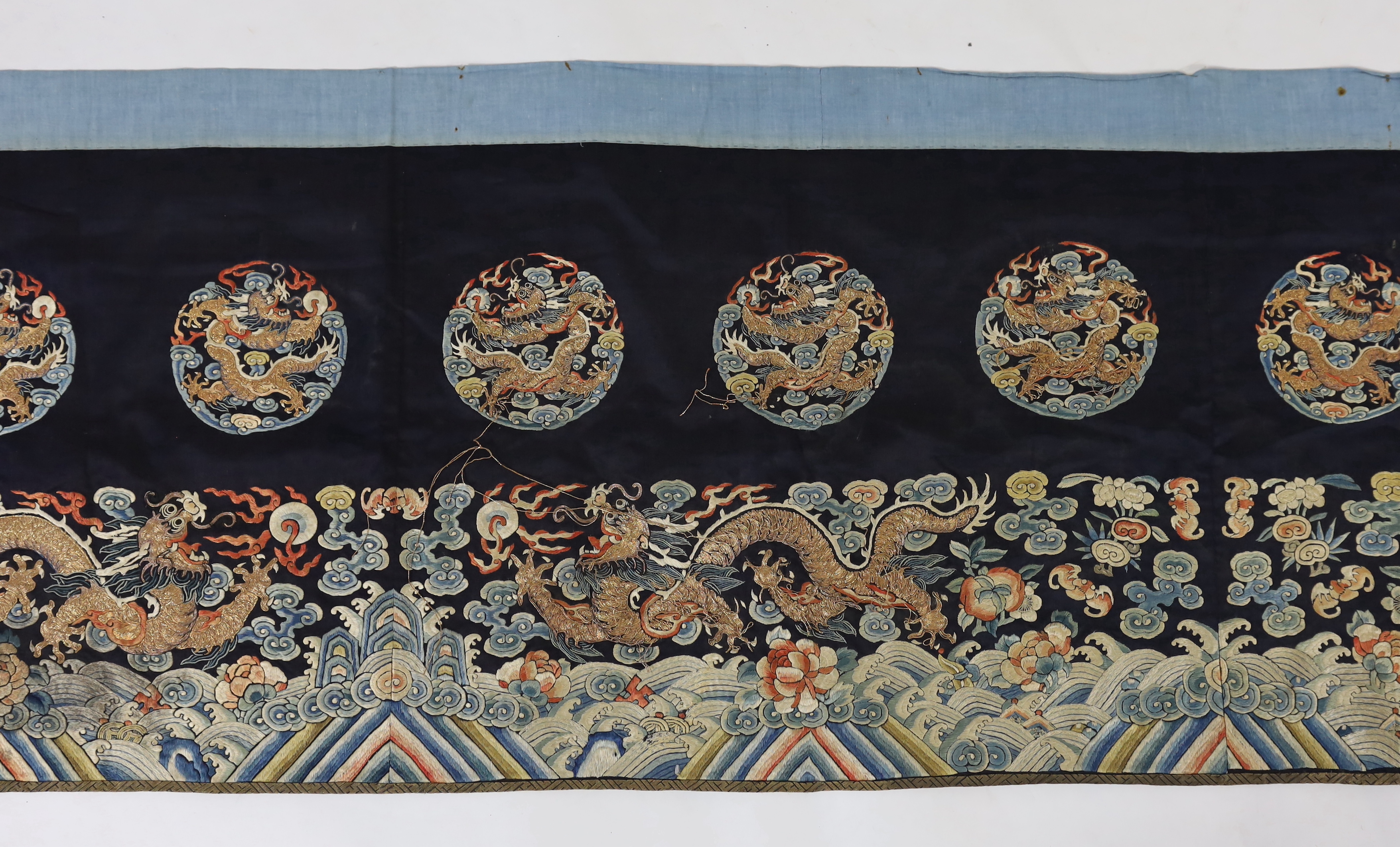 A Chinese embroidered silk 'dragon' table frontal, 19th century, damage